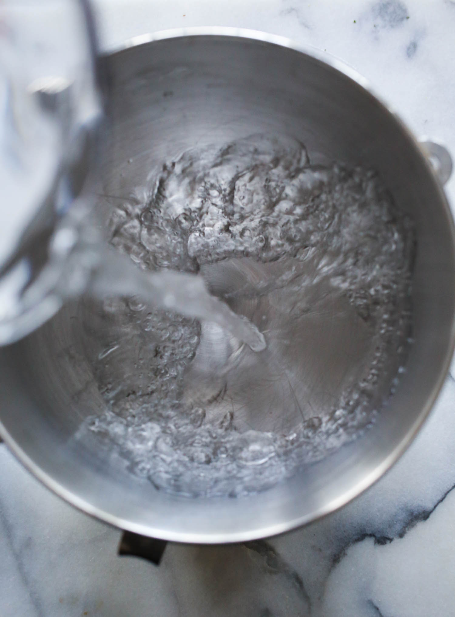 adding water to bowl for breadsticks from our best bites