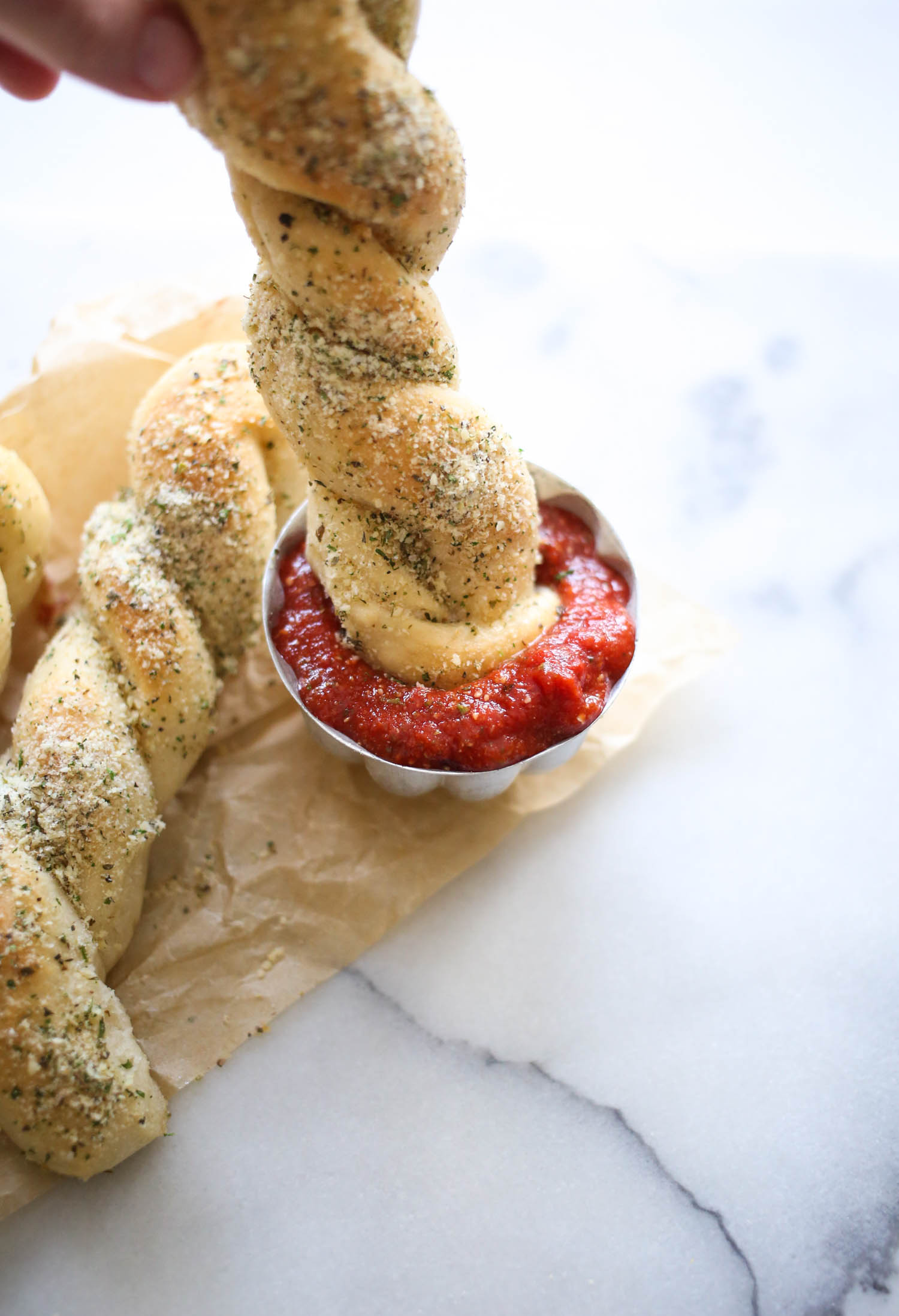 dipping breadstick in marinaara
