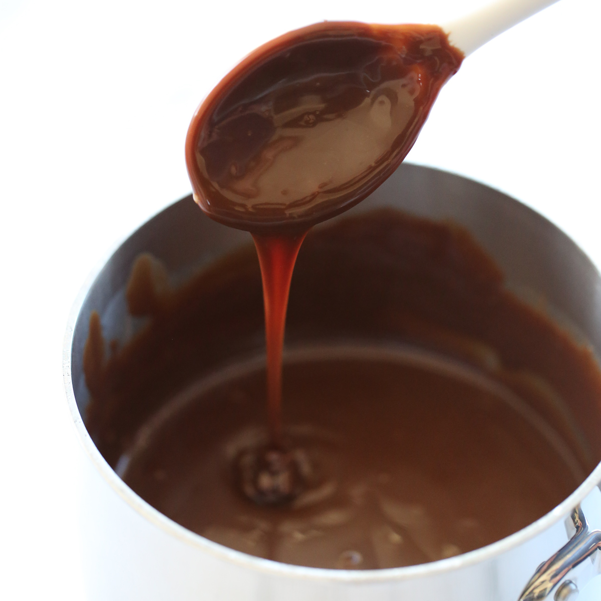 hot fudge sauce on a spoon