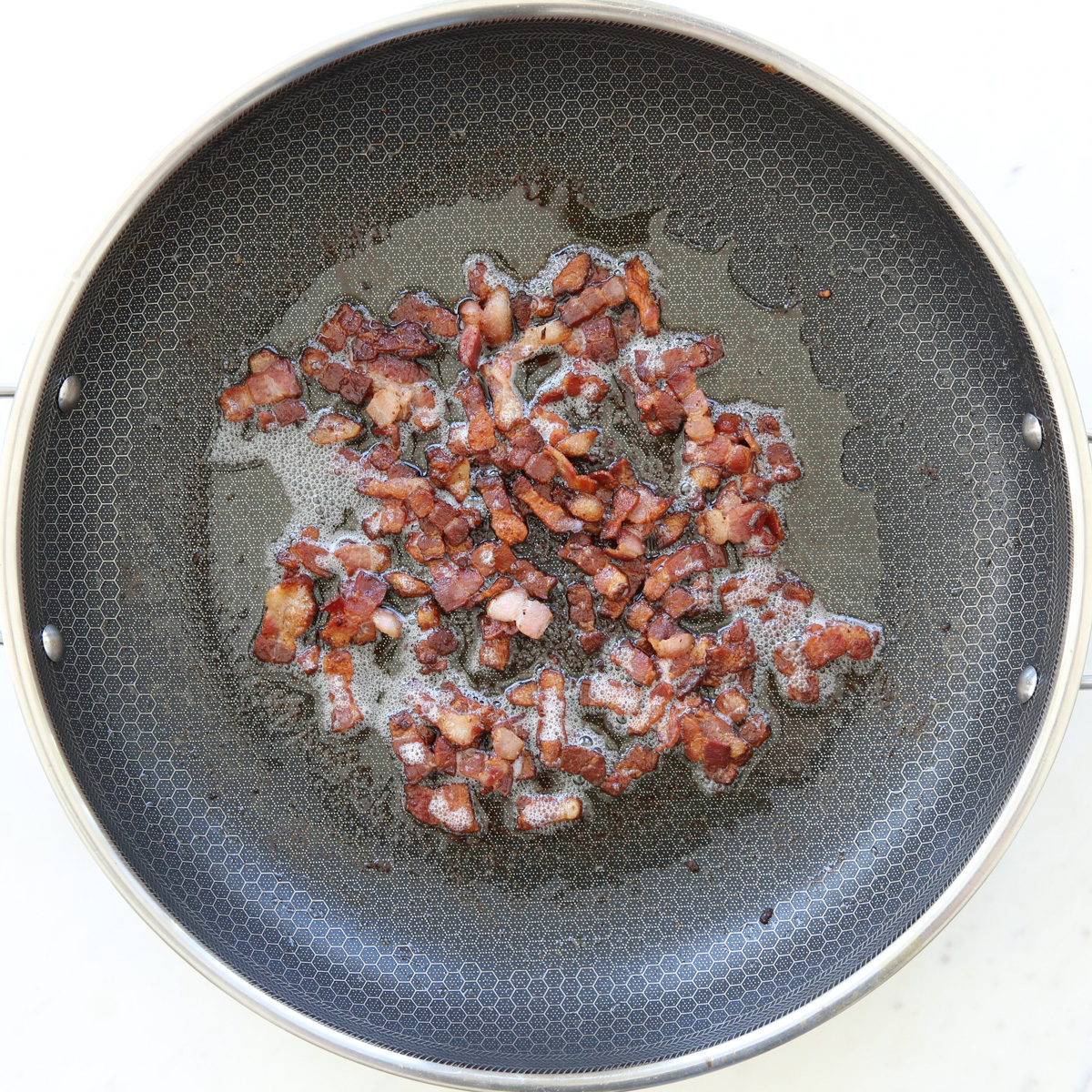 cooking bacon in a skillet