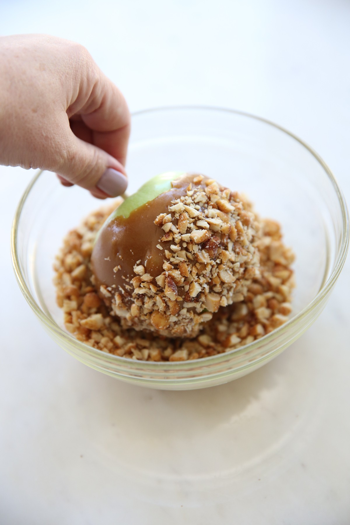 apple dipped in caramel and peanuts