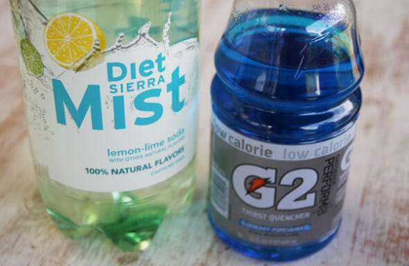 A bottle of diet Sierra Mist and Blue Gatorade G2.
