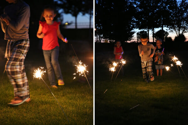 kids running through sparklers