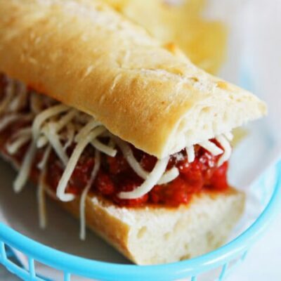 A close up of a meatball sub in a basket.
