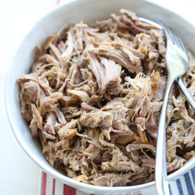 shredded kalua pork in a white bowl