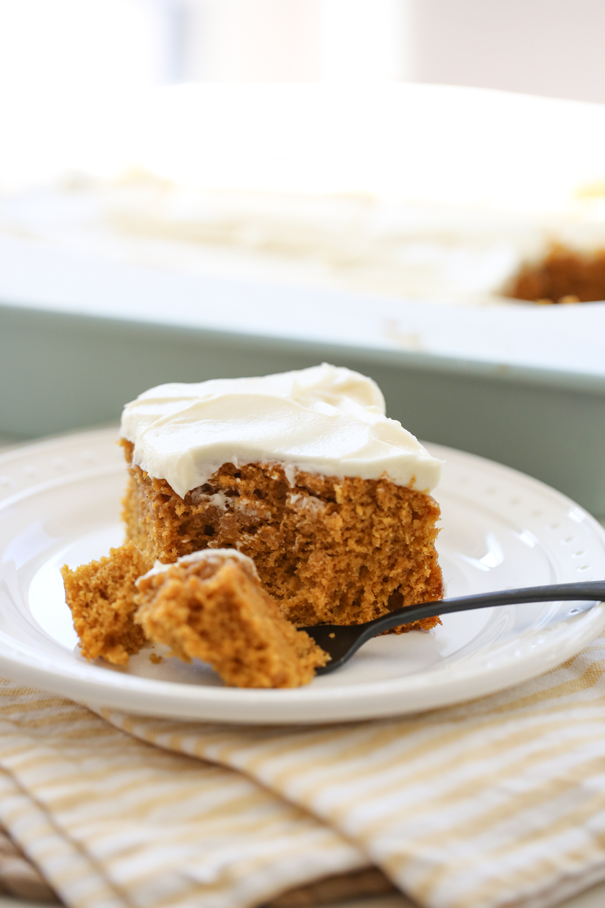 Pumpkin Cake with Cream Cheese Frosting on a plate