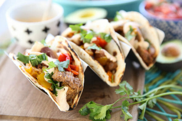 3 small fajitas in tortillas