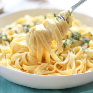 Pumpkin alfredo on a fork