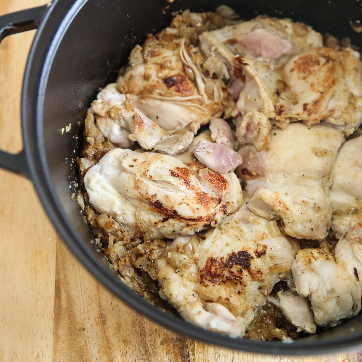 seared chicken in pot of stew