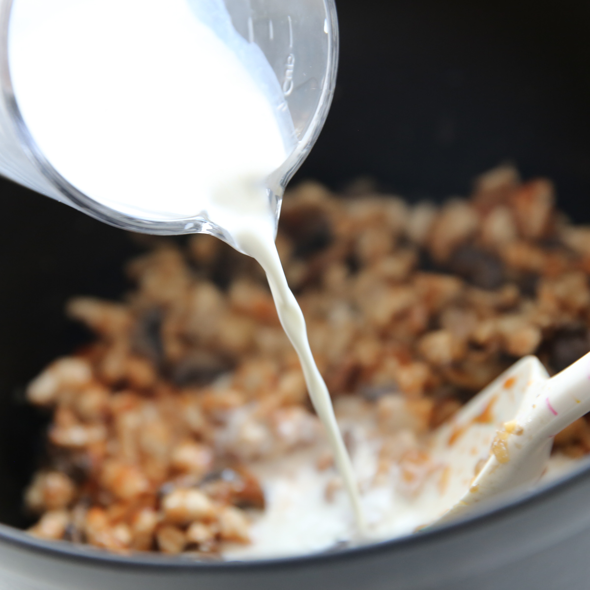 Adding cream to pot