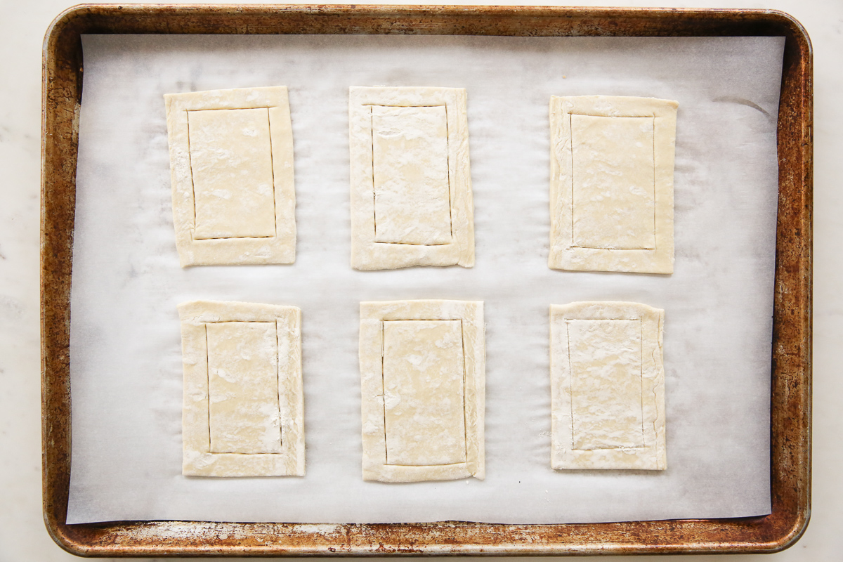 puff pastry cut into small pieces on a cookie sheet 