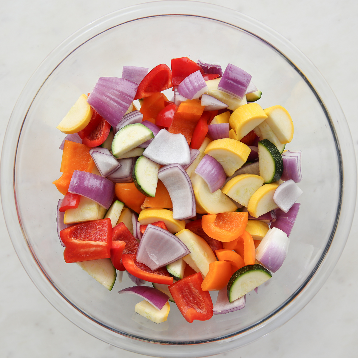 chopped vegetables in a glass bowl